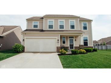 Inviting two-story home with a spacious two-car garage and well-manicured front lawn at 10447 Pintail Ln, Indianapolis, IN 46239