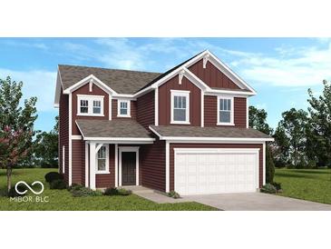 Two-story home featuring a red siding, white trim, a two car garage, and a well manicured front yard at 1943 Black Oak Dr, Shelbyville, IN 46176
