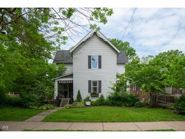 Charming two-story home with a landscaped front yard and inviting porch at 232 S Audubon Rd, Indianapolis, IN 46219