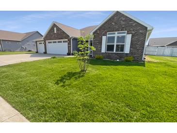 Charming home featuring a well-manicured lawn and a neatly designed exterior at 2913 Lily Dr, Lebanon, IN 46052