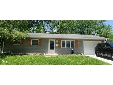 Charming single-story home featuring gray siding, wood shutters, and a well-manicured front yard at 5 Fairlane East Ct, Danville, IN 46122