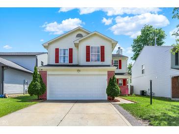 Charming two-story home featuring red shutters, a two-car garage, and a well-maintained front yard at 539 Deer Trail Dr, Indianapolis, IN 46217