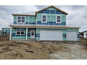New construction home featuring a two-car garage and modern architectural design at 6031 Madera Dr, Whitestown, IN 46075