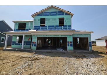 View of a two-story home under construction with visible framing and protective wrap at 6031 Madera Dr, Whitestown, IN 46075