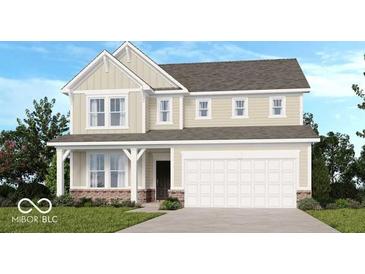 Charming two-story home features a covered front porch and a two-car garage at 1126 Bevy Blvd, Danville, IN 46122
