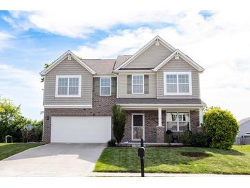 Beautiful two-story home with a well-manicured lawn and attached two car garage at 635 Sonoma Ln, Greenfield, IN 46140
