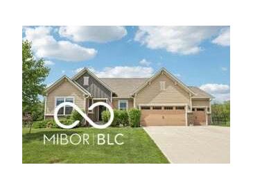 Charming single-story home with a well-maintained lawn and a two-car garage at 19175 English Lake Ln, Noblesville, IN 46062