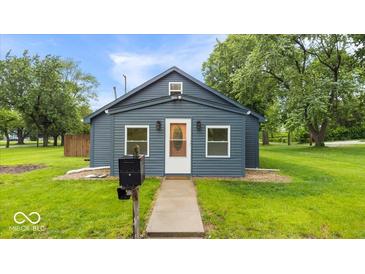 Charming single-story home with neat landscaping, a new roof, and a welcoming front door at 450 Pleasant St, Noblesville, IN 46060
