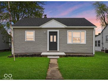 Charming single-story home featuring a well-manicured lawn and inviting entrance at 618 Miller Ave, Shelbyville, IN 46176