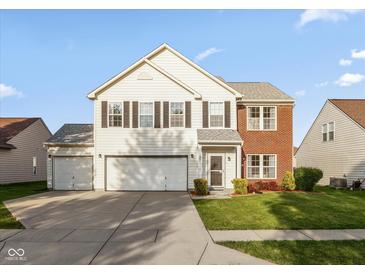 Charming two-story home with a two-car garage and well-maintained front lawn at 5891 Mimosa Dr, Indianapolis, IN 46234