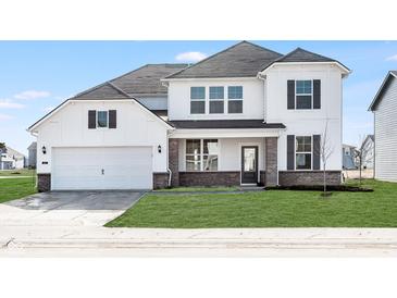 Beautiful two-story home with a two-car garage, brick accents, and manicured lawn at 18967 Seaforth Way, Westfield, IN 46074