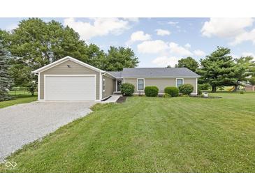 Charming single story home featuring a one car garage and meticulously manicured lawn at 3020 E 400 S, Lebanon, IN 46052
