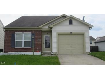 Charming single Gathering home featuring a well maintained lawn and a one car garage at 3908 Roundwood Dr, Indianapolis, IN 46235