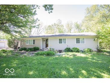 Charming single-story home with a well-maintained lawn and mature trees, offering great curb appeal at 4023 Cedar Hills South Dr, Greenwood, IN 46143