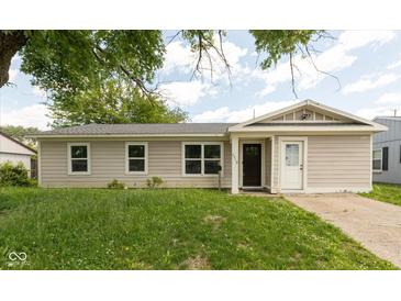 Charming single-story home with a well-maintained lawn and inviting front entrance at 2519 N Boehning St, Indianapolis, IN 46219