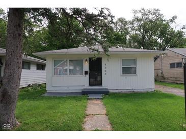 Charming single-story home featuring a minimalist design and a well-maintained front yard at 4353 Evanston Ave, Indianapolis, IN 46205