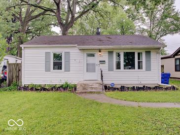 Charming home featuring a well-maintained lawn and lovely landscaping at 4415 N Longworth Ave, Indianapolis, IN 46226