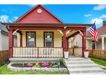 Inviting home featuring a cozy front porch and a well-kept yard at 1333 Spann Ave, Indianapolis, IN 46203