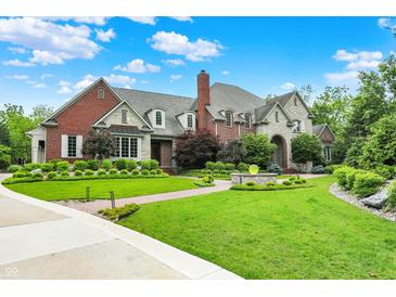 Beautiful brick and stone home with manicured landscaping and inviting curb appeal at 20170 Starlight Ct, Noblesville, IN 46062