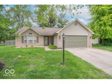 Charming one-story home with a brick facade, attached garage, and a well-manicured lawn at 3898 Chelsea Ter, Greenwood, IN 46143