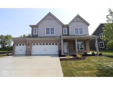 Charming two-story home with a three-car garage and a beautifully landscaped front yard at 5517 Sienna Ct, Brownsburg, IN 46112