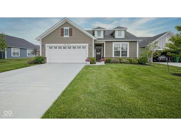 Charming home with a well-manicured lawn and attached two car garage at 19144 Goins Blvd, Westfield, IN 46074