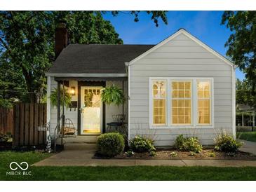 Charming single-story home with a cozy front porch and well-maintained landscaping at 2521 Mcleay Dr, Indianapolis, IN 46220