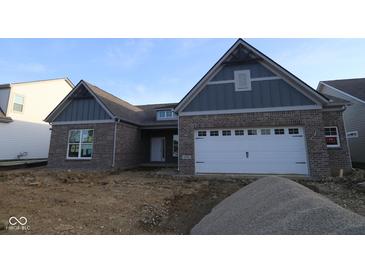 Inviting new construction home with charming brick facade and attached two-car garage at 4290 Ironclad Dr, Bargersville, IN 46106