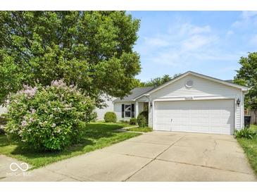 Charming single-Gathering home with a well-manicured lawn and attached two-car garage at 8446 S Paddleboat Ln, Pendleton, IN 46064