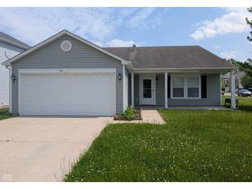 Charming single-story home with attached garage and well-maintained lawn at 901 Westpointe Dr, Shelbyville, IN 46176