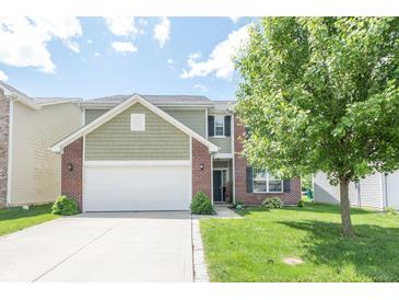 Charming two-story home with brick and shingle exterior, landscaped yard, and attached two-car garage at 935 Northwich Ave, Westfield, IN 46074
