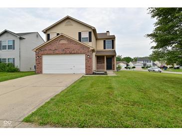 Inviting two-story home with a brick-accented garage and well-manicured lawn at 10722 Mistflower Way, Indianapolis, IN 46235