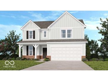 Charming two-story home with a front porch, attached two-car garage, and professionally landscaped yard at 1085 Bevy Blvd, Danville, IN 46122