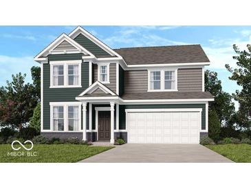 Charming two-story home with a two-car garage and well-manicured lawn at 1088 Bevy Blvd, Danville, IN 46122