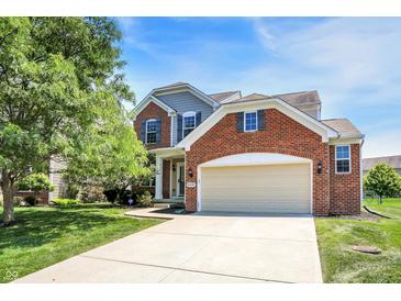 Charming two-story home with a brick facade and well-manicured lawn at 14499 Milton Rd, Fishers, IN 46037