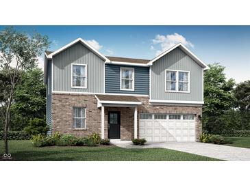 Charming two-story home with brick and gray siding, a front-entry garage, and well-manicured landscaping at 2124 Foothill Dr, Greenfield, IN 46140