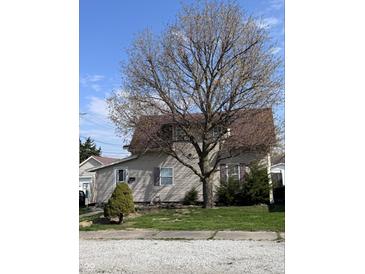 Charming two-story home with mature tree offering shade and curb appeal at 2208 S F St, Elwood, IN 46036
