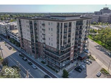 Beautiful condo building exterior with balconies, street views, and convenient parking at 435 Virginia Ave # 108, Indianapolis, IN 46203