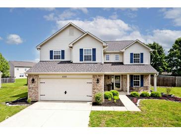 Charming two-story home with blue shutters and attached two-car garage at 1222 Grand Canyon Ct, Franklin, IN 46131