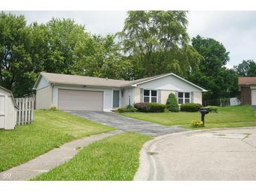 Charming single-story home with a well-maintained front yard and a two-car garage at 3612 Carolee Ct, Indianapolis, IN 46227