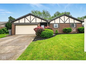 Charming brick home with a well-manicured lawn and fresh landscaping at 4701 Candy Spots Dr, Indianapolis, IN 46237
