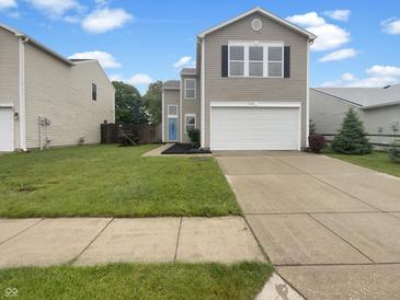 Charming two-story home featuring a well-maintained lawn, concrete driveway, and inviting curb appeal at 15110 Fawn Hollow Ln, Noblesville, IN 46060
