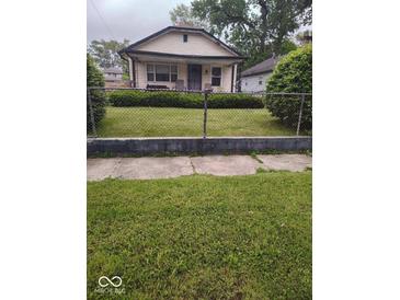 Charming single-Gathering home with a well-maintained front yard and classic architectural details at 2037 Houston St, Indianapolis, IN 46218