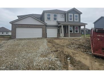 New two-story home with a brick-accented front and a two-car garage at 2287 Oakmont Dr, Plainfield, IN 46168