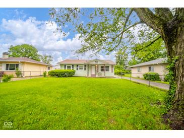 Charming single-story home with a well-manicured lawn and mature tree at 2726 Apache Dr, Anderson, IN 46012