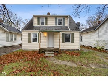 Charming two-story home with siding and inviting front entrance at 3305 N Arlington Ave, Indianapolis, IN 46218