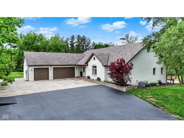 Charming single-Gathering home with a well-manicured lawn, two car garage and brick accents at 4495 W Stones Crossing Rd, Greenwood, IN 46143