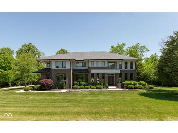 Stunning two-story home featuring a modern design, manicured lawn, and lush landscaping for enhanced curb appeal at 4691 Pascagoula Run, Greenwood, IN 46143