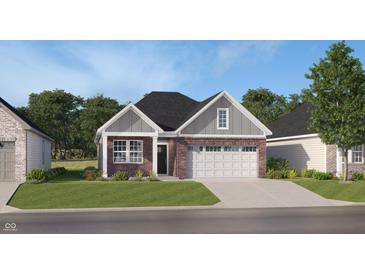 Charming single Gathering home with brick and gray siding and well-maintained landscaping at 611 Bridgeman Rd, Avon, IN 46123