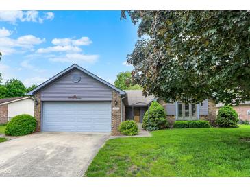 Charming single-story home featuring a two-car garage and well-maintained landscaping at 926 Brookside Ln, Plainfield, IN 46168